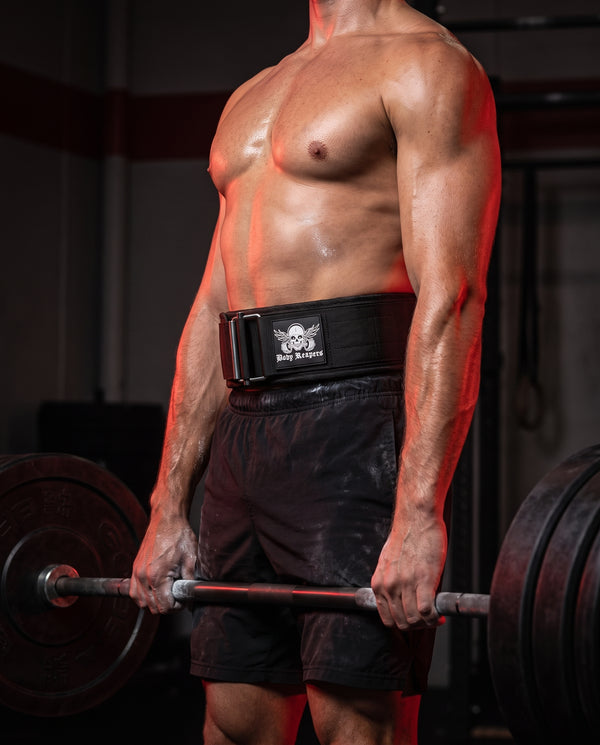 Male athlete wearing the Body Reapers Auto-Locking Belt during a heavy deadlift