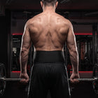 Body Reapers auto-locking belt worn across the lower back at a barbell